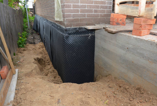 SJ Waterproofing Pros technician performing targeted Waterproofing assessment in North Newton, KS